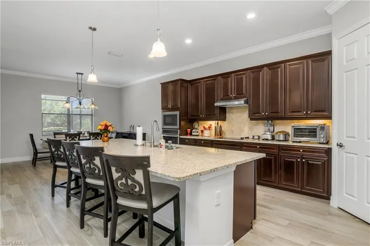 Elegant pendant Lighting and Stylish Granite Counters