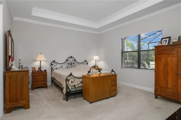 Primary Bedroom with Window to Pool and backyard Views