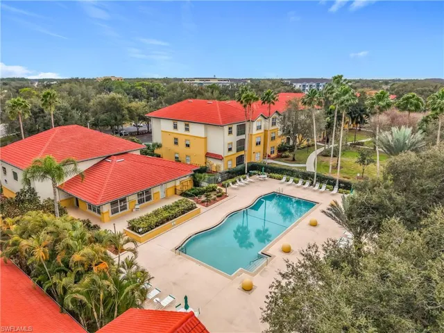 Community pool with a patio