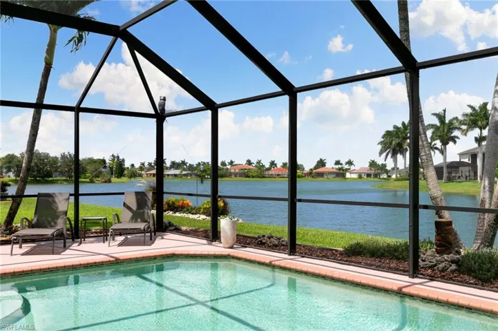 View of pool featuring glass enclosure