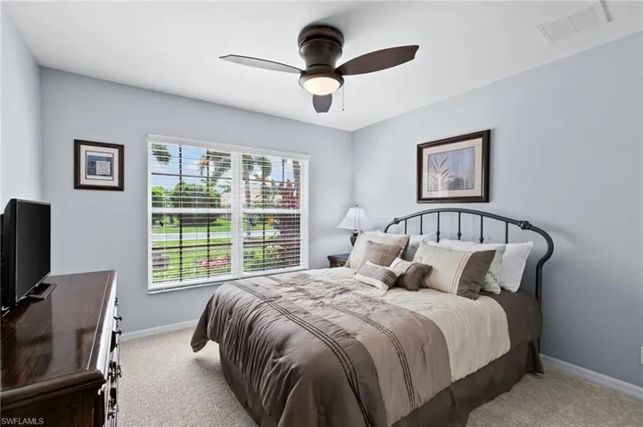 Bedroom with carpet and ceiling fan