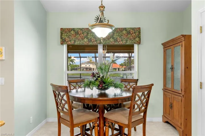 Dining area featuring light tile flooring