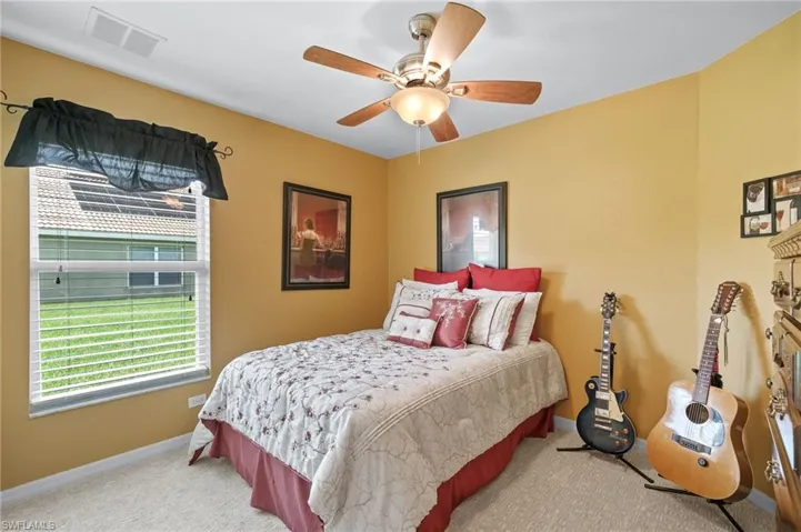 Bedroom with carpet floors and ceiling fan