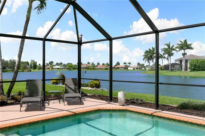 View of swimming pool featuring a lanai