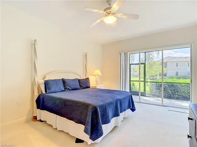 Spacious room featuring light-colored carpeting and a ceiling fan with integrated lighting