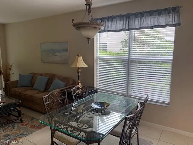 Tiled dining area featuring healthy amount of natural light