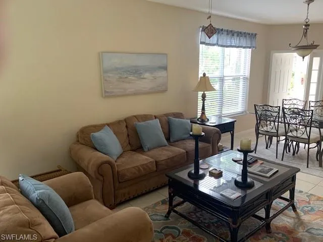 Living area with light tile patterned flooring