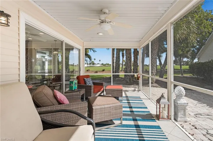 A sun-soaked screened lanai and expansive pavered patio provide the perfect setting for entertaining or enjoying the action on the golf course.