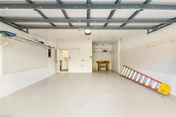 The Vines Exercise room featuring a ceiling fan and a paneled ceiling