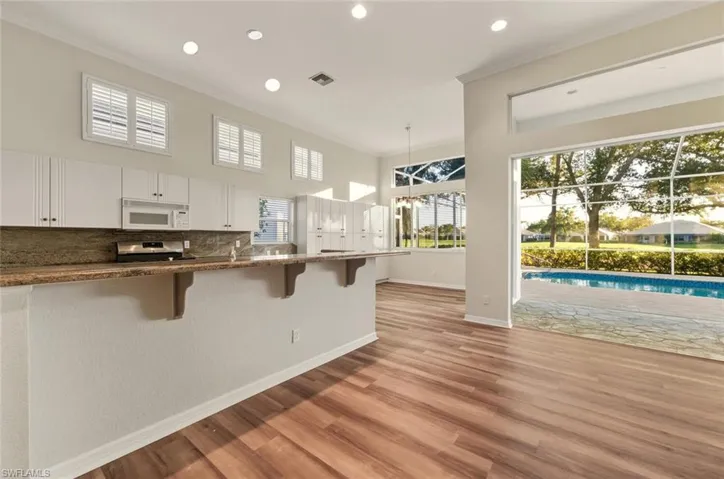 Staged Kitchen / breakfast area crown molding, wood finished floors