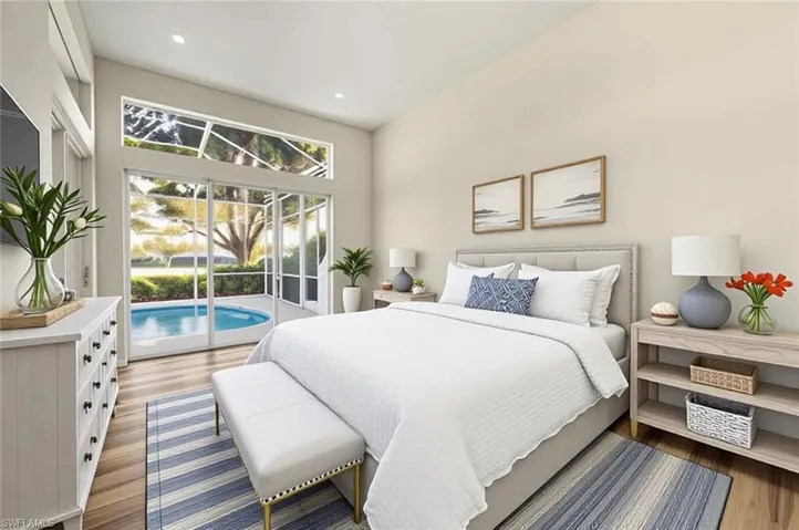 Full bath with vanity, bathing tub / shower combination, and light wood-style floors