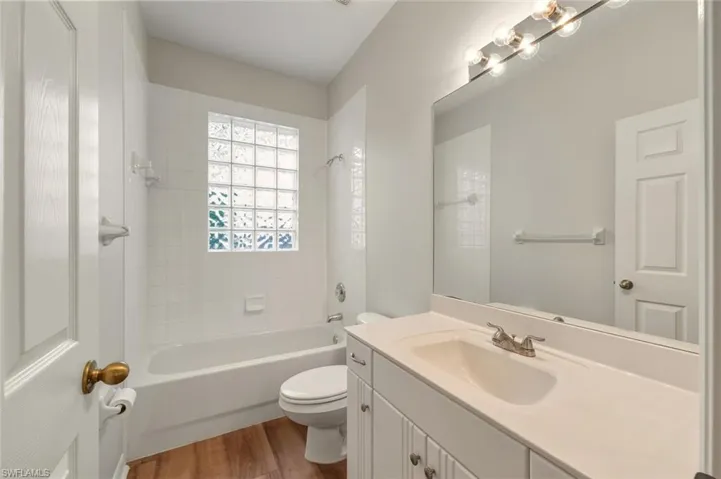 Unfurnished breakfast area with New Light featuring ornamental molding, dark wood-type flooring, healthy amount of natural light looking out to the golf cource