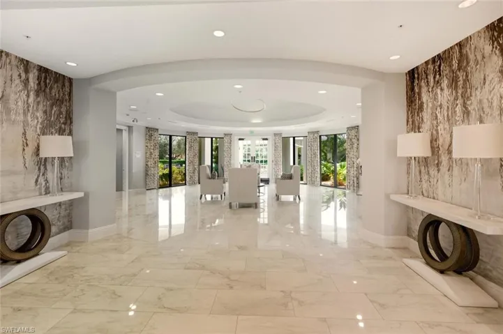 Unfurnished dining area with ornamental molding, dark wood-style floors, and a chandelier
