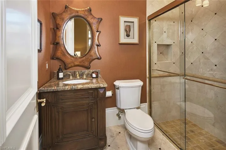 Bathroom featuring vanity and a shower stall