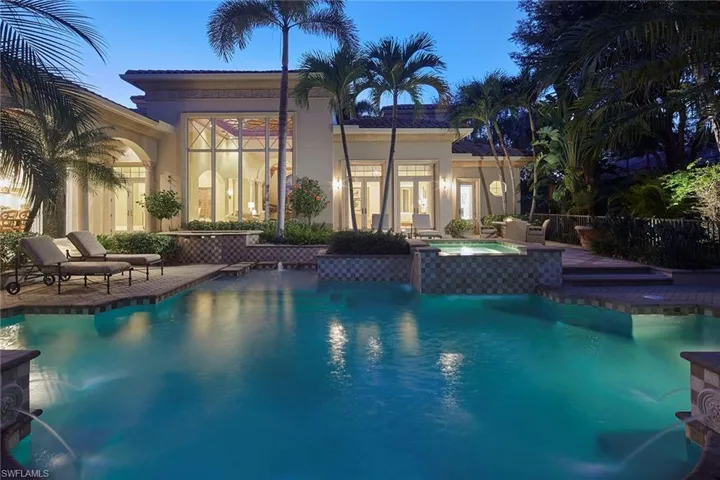 View of pool featuring a patio area and a pool with connected hot tub
