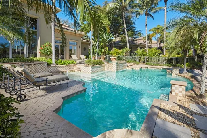 View of swimming pool featuring a patio and an outdoor hot tub