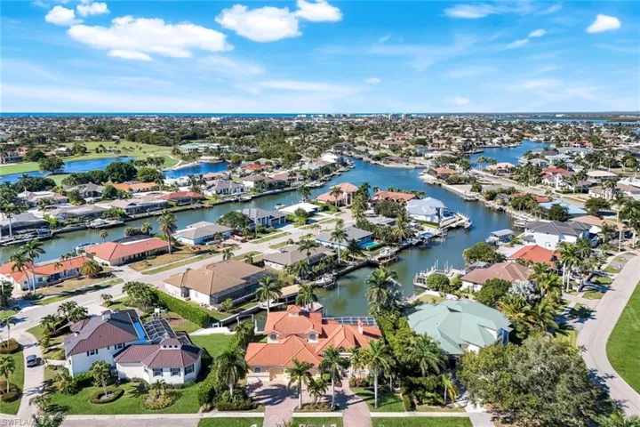 Aerial view of residential area with a large body of water
