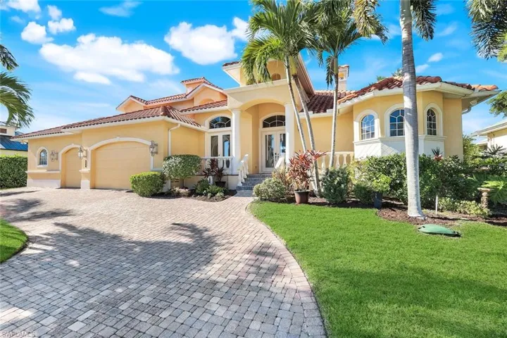 Mediterranean style home with welcoming circle driveway
