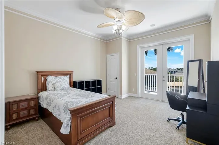 Second bedroom upstairs, french doors to patio.
