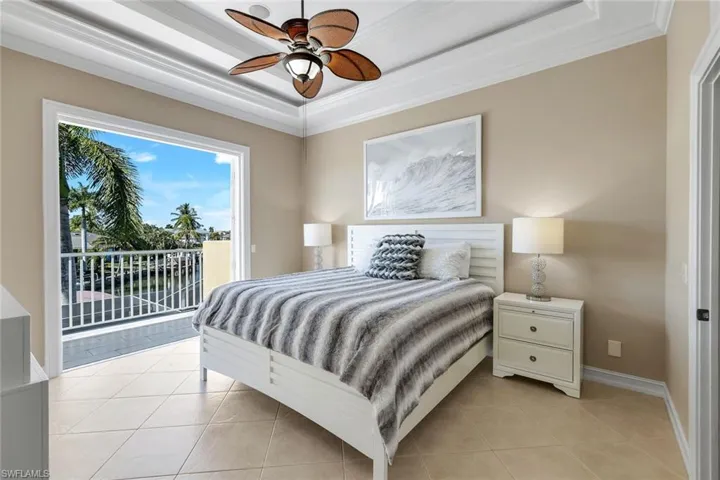 Upstairs large bedroom with french doors and patio, walk in closet