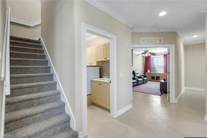 Stairs, laundry/garage, media room, hall