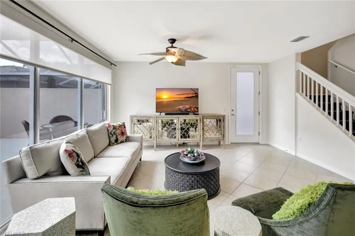 Tiled living room with ceiling fan
