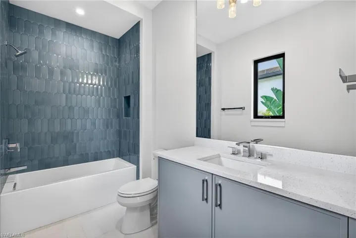 Bathroom 3  has beautiful tile shower and tub combination