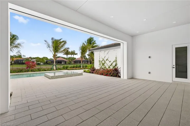 Large outdoor living space has remote screen