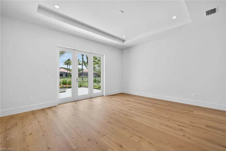 Master bedroom features french doors leading to  private terrace with gas fire pit