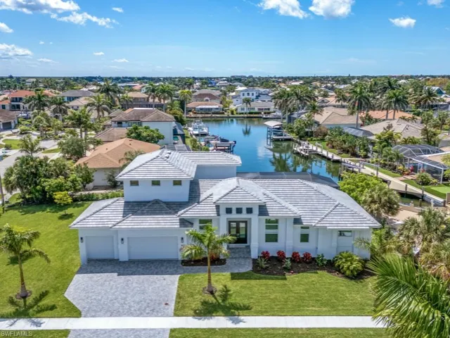 Aerial view of residential area with a large body of water