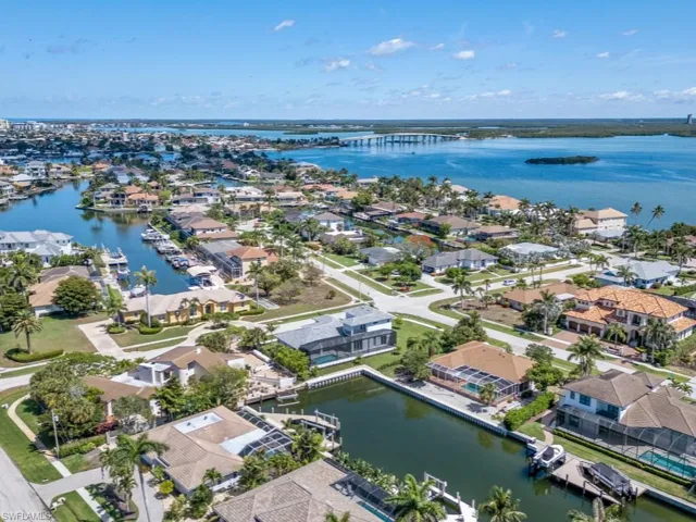 Aerial view of residential area featuring a large body of water