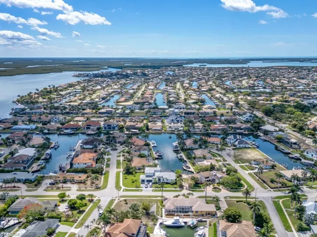 View of property location with a large body of water and nearby suburban area