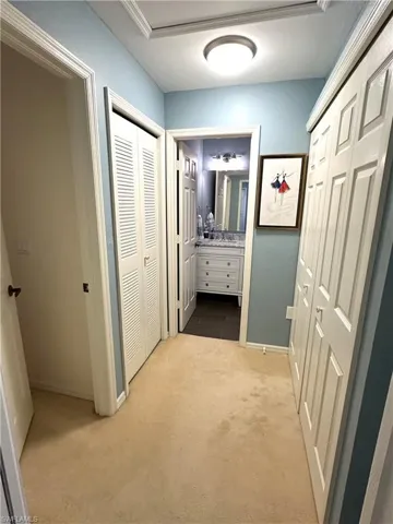 Laundry closet on the right, utility closet on the left between guest room entrance and guest bathroom as well as attic access