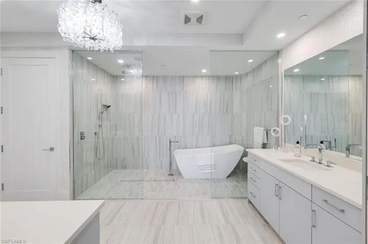 The expansive walk-in shower and soaking tub invite moments of pure relaxation.