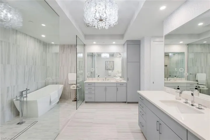 Designed with relaxation in mind, the primary ensuite showcases a soaking tub, dual sinks, and a generously scaled walk-in shower.