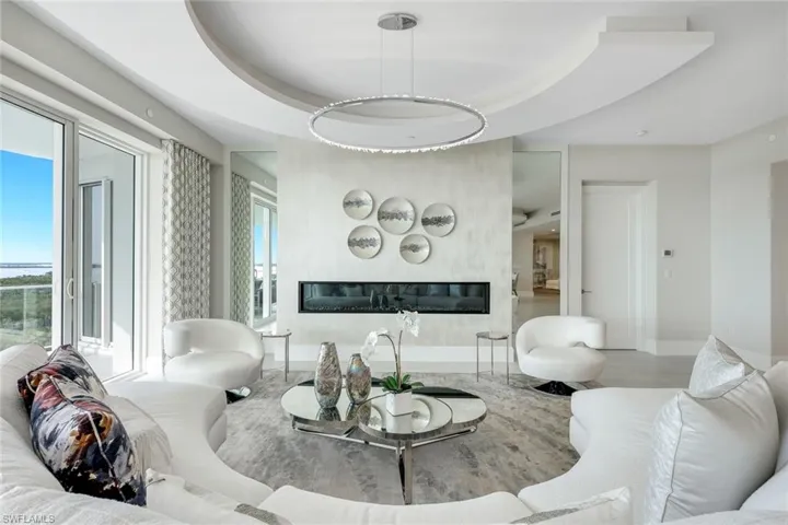 The decorative fireplace lends a warm, inviting ambiance to the space.
