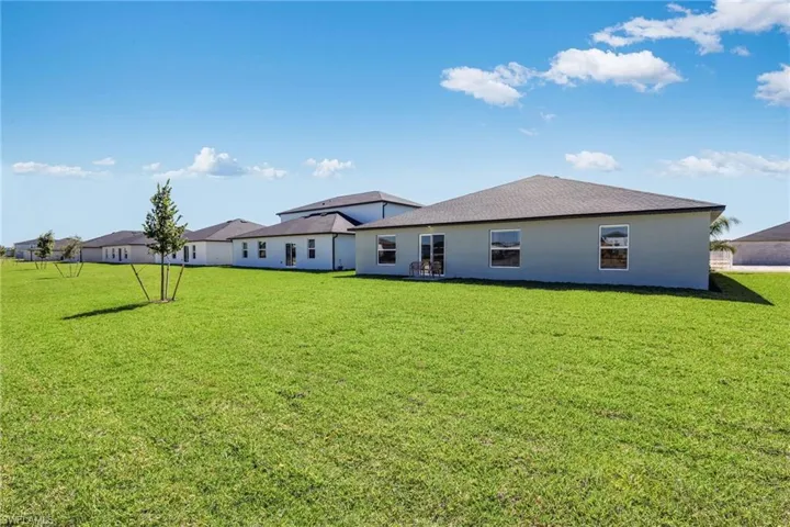 Expansive green lawn providing ample outdoor space