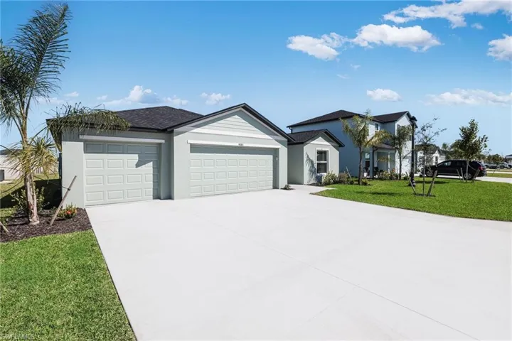 Contemporary single-story residence with a two-car garage and a paved driveway