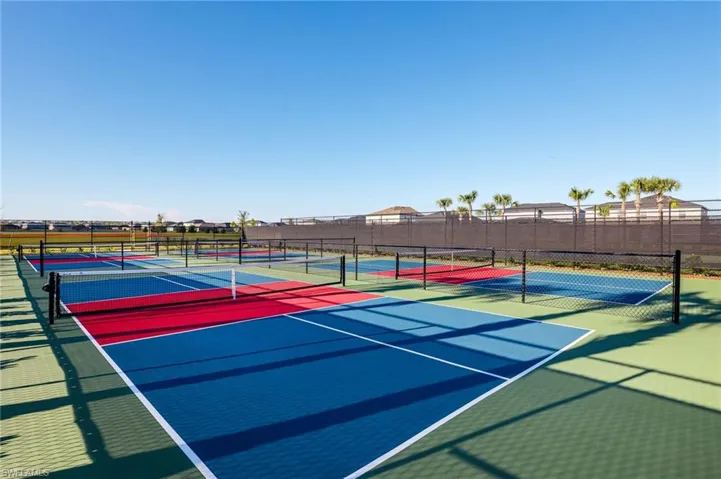 Multiple sports courts featuring vibrant red, blue, and green surfacing