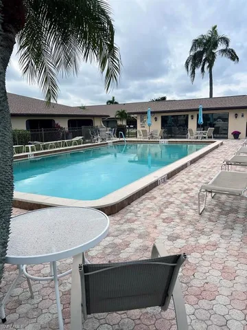 Community pool featuring a patio area