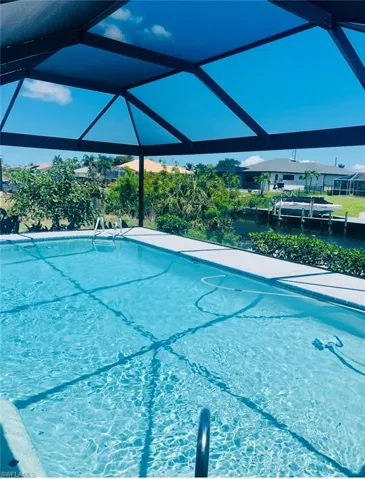 Outdoor pool featuring glass enclosure
