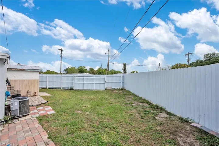 Fenced backyard featuring a patio