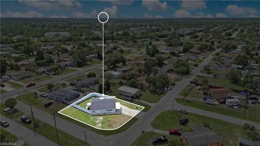Aerial view of residential area with property boundaries highlighted