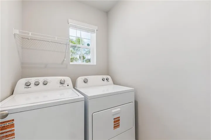 Washroom featuring independent washer and dryer