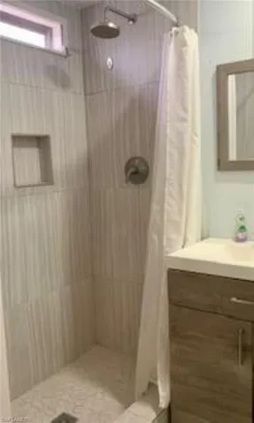 Bathroom with vanity and a shower with curtain
