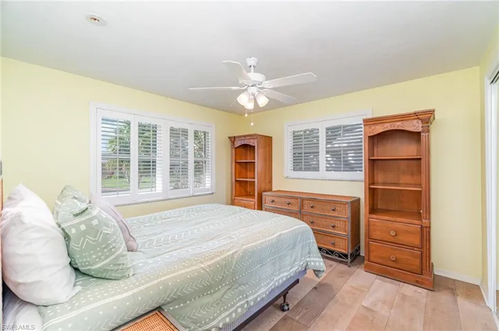 Bedroom featuring light wood-style flooring and a ceiling fan