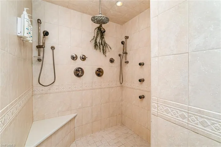 Bathroom with a tile shower and recessed lighting