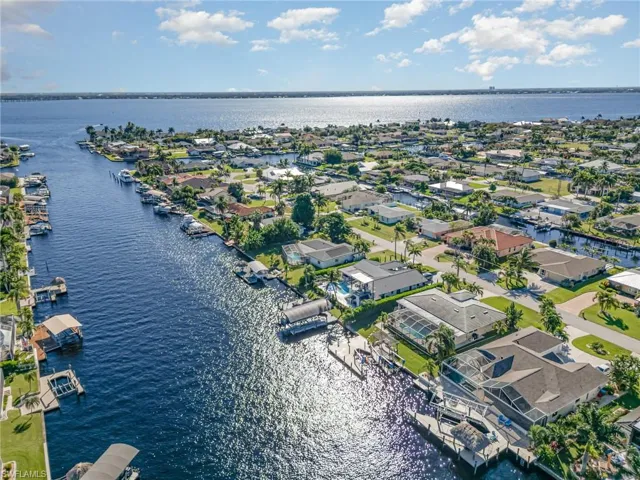 Aerial perspective of suburban area with a nearby body of water