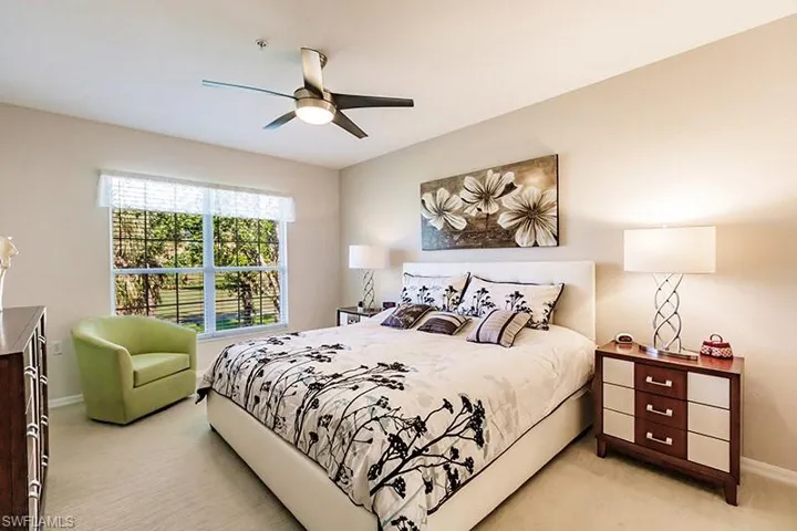 Bedroom with light carpet and ceiling fan