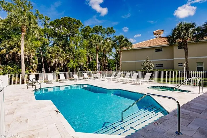 View of pool featuring a patio and a community hot tub